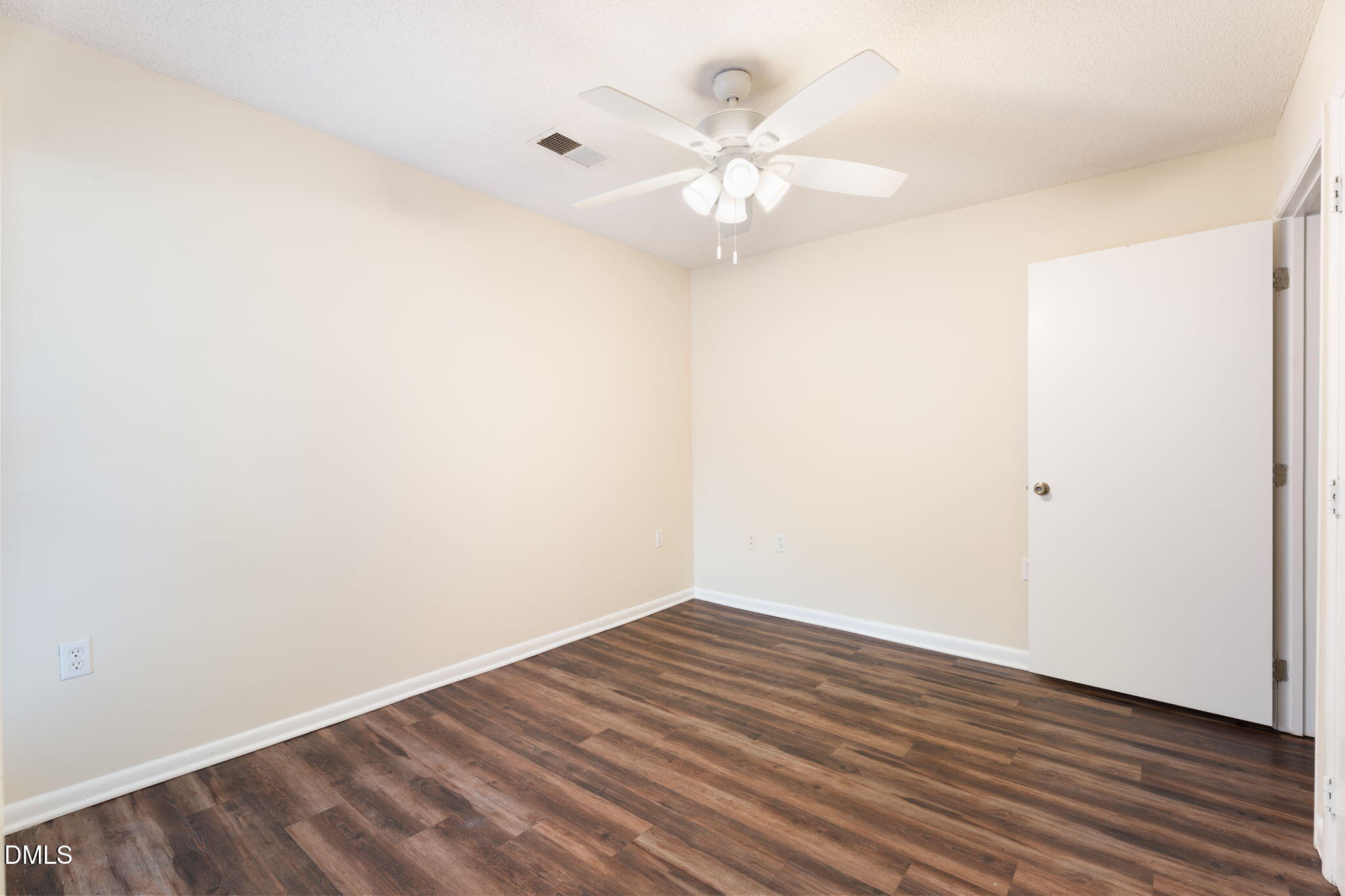 1420 Collegiate Circle Raleigh, NC 27606 - Photo 6 of 30 a view of an empty room with wooden floor