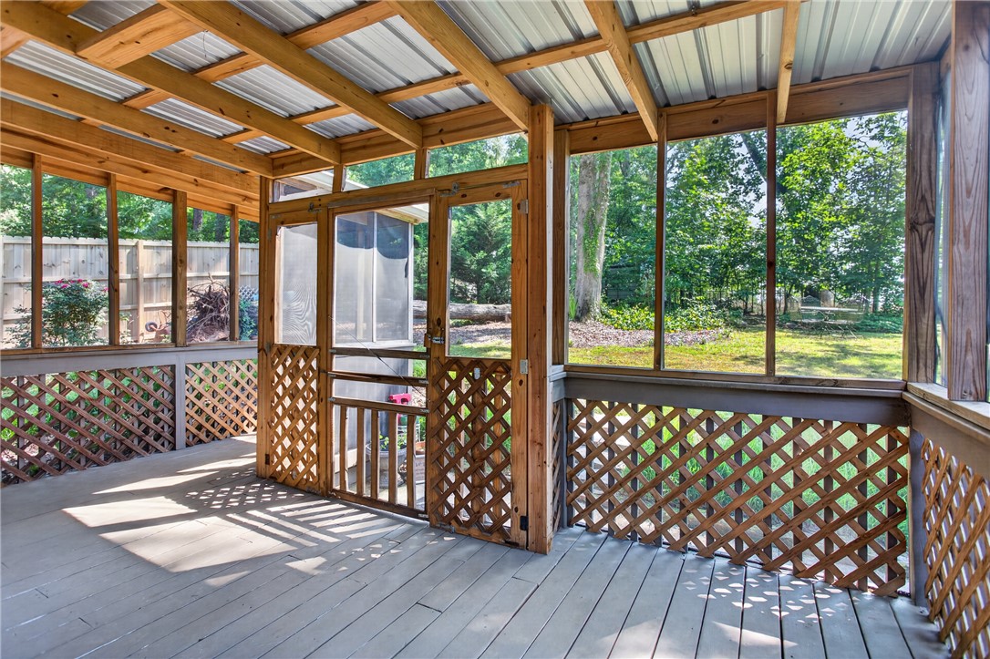 151 Towne Creek Trail Anderson, SC 29621 - Photo 38 of 49 Enjoy nature's embrace from this inviting screened porch, a serene extension of outdoor living.