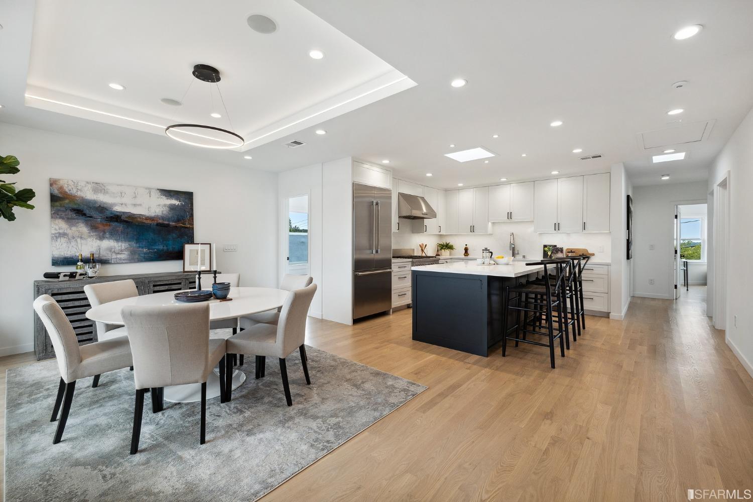 65 Westgate Drive San Francisco, CA 94127 - Photo 11 of 51 a kitchen with a dining table wooden floor stainless steel appliances and cabinets