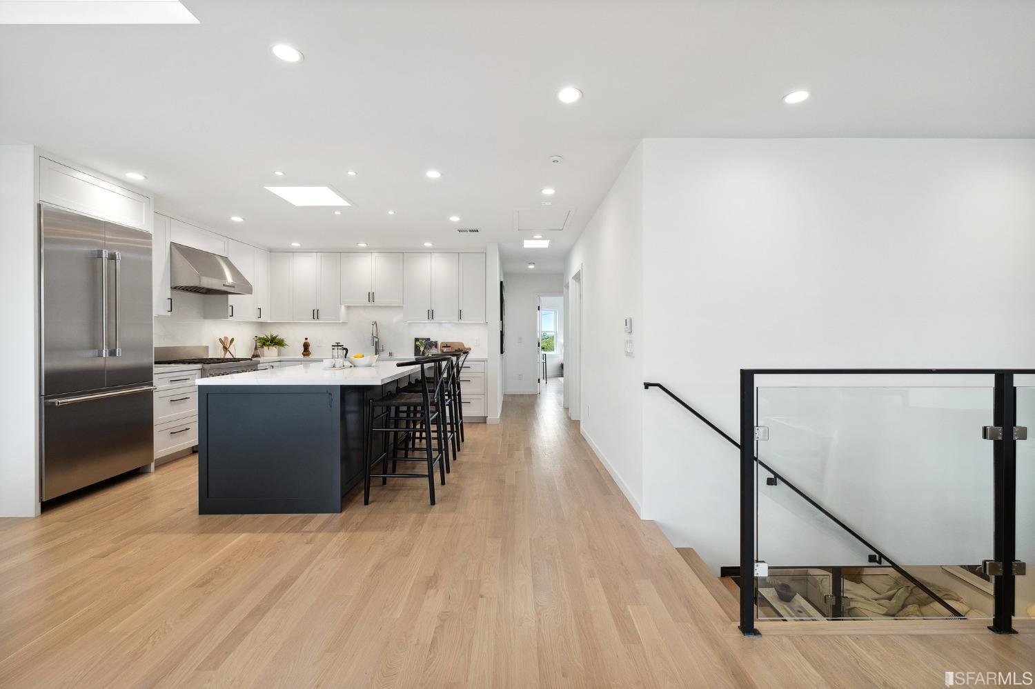 65 Westgate Drive San Francisco, CA 94127 - Photo 16 of 51 a kitchen with stainless steel appliances kitchen island granite countertop a refrigerator a sink and a microwave