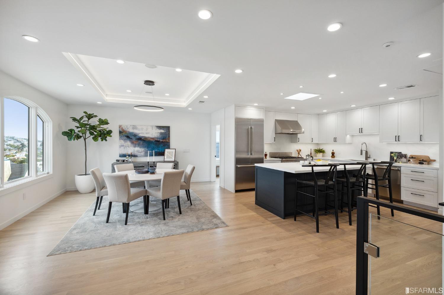 65 Westgate Drive San Francisco, CA 94127 - Photo 8 of 51 a dining hall with stainless steel appliances kitchen island a table and chairs in it