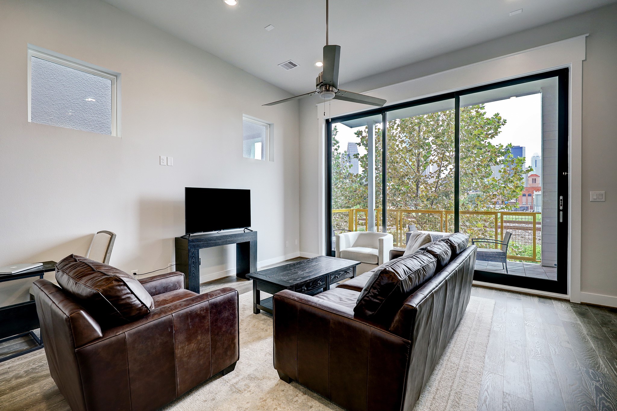 1203 Hickory Street, Unit D Houston, TX 77007 - Photo 11 of 23 a living room with furniture and a flat screen tv