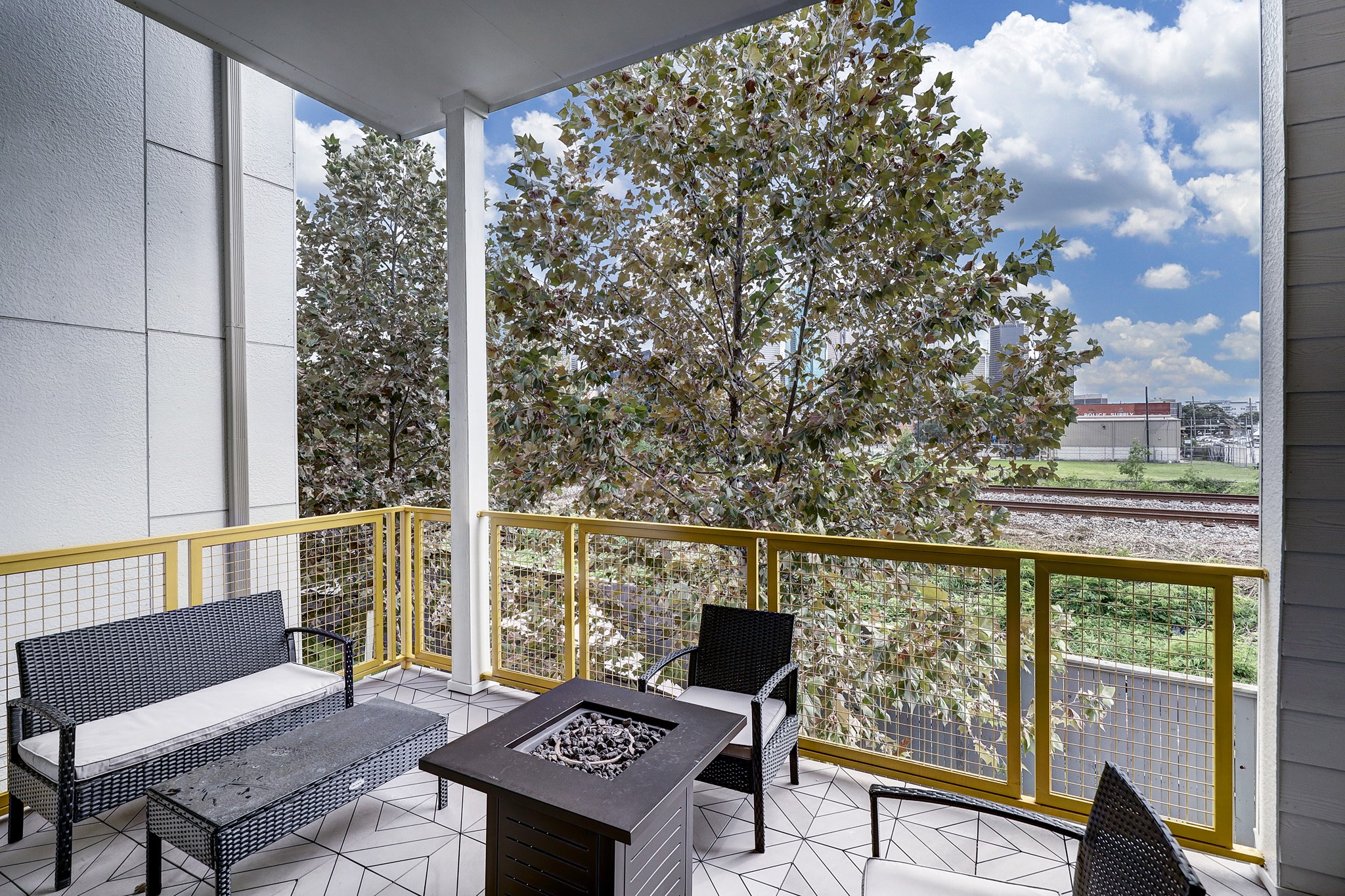 1203 Hickory Street, Unit D Houston, TX 77007 - Photo 15 of 23 a view of a chairs and table on the balcony