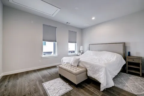 a bedroom with a bed and a couch