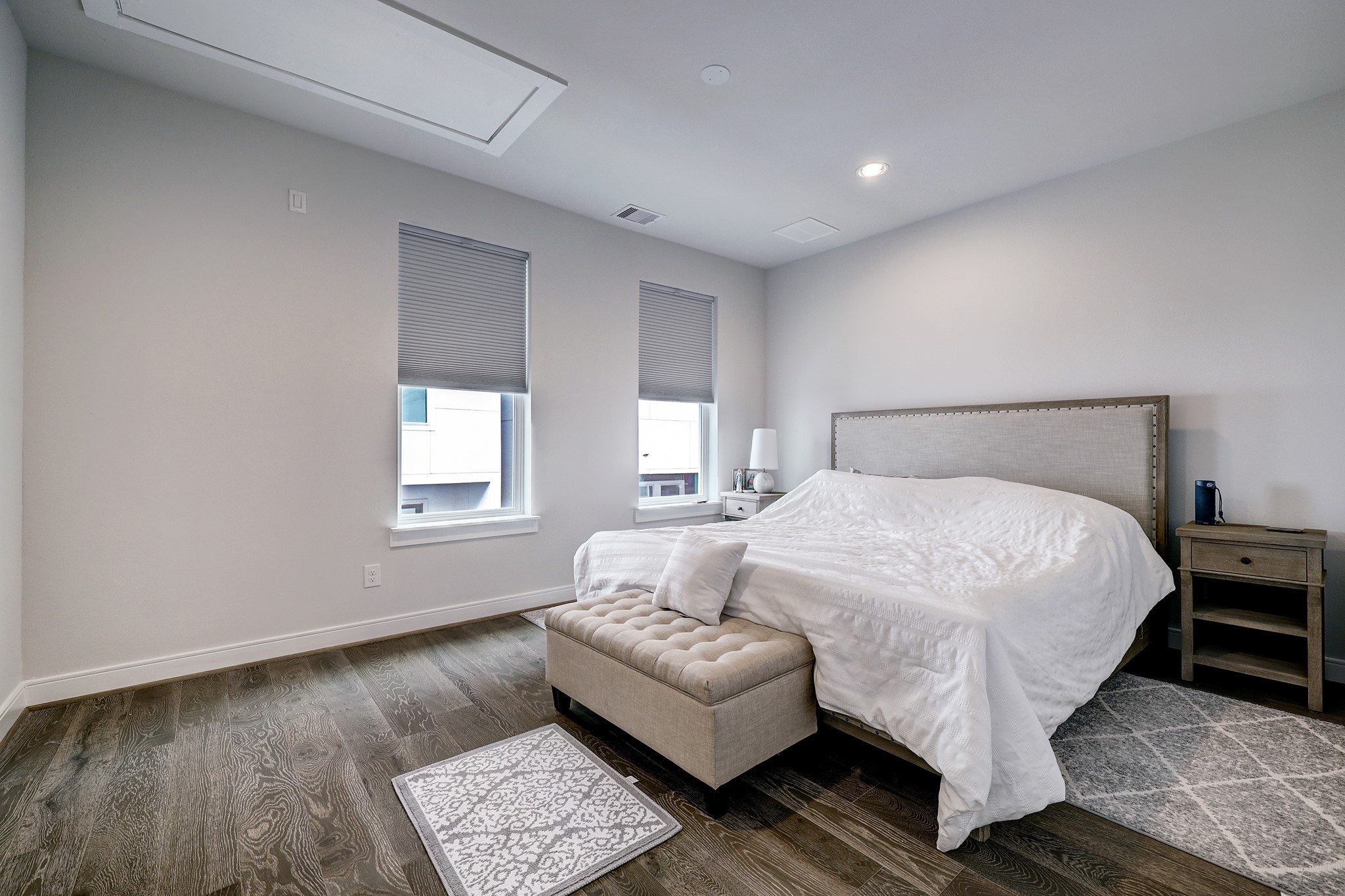 1203 Hickory Street, Unit D Houston, TX 77007 - Photo 16 of 23 a bedroom with a bed and a couch