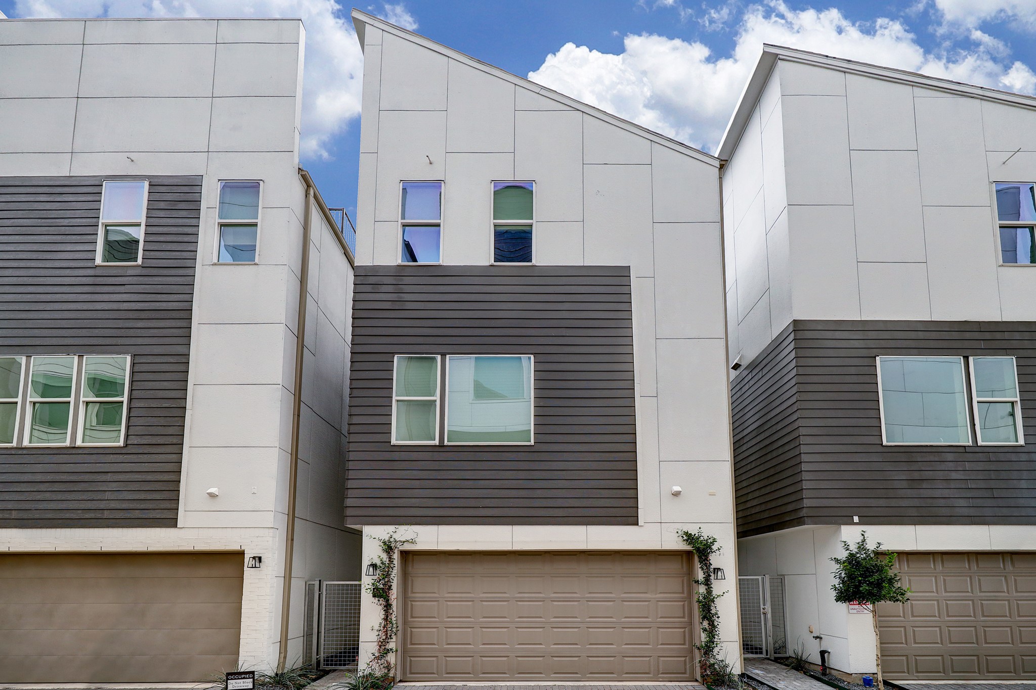 1203 Hickory Street, Unit D Houston, TX 77007 - Photo 3 of 23 a view of a house with a garage