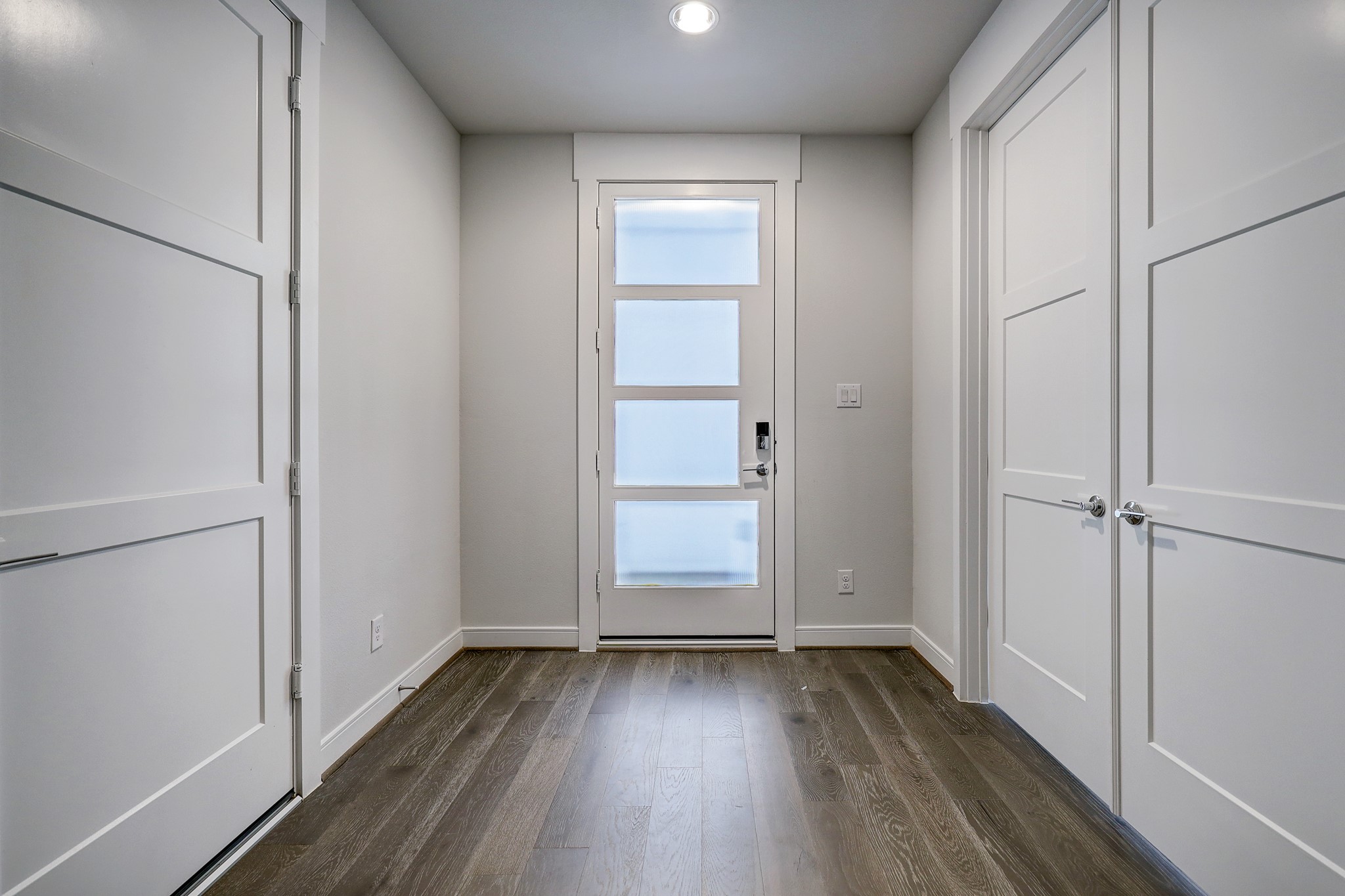 1203 Hickory Street, Unit D Houston, TX 77007 - Photo 5 of 23 an empty room with wooden floor closet and windows