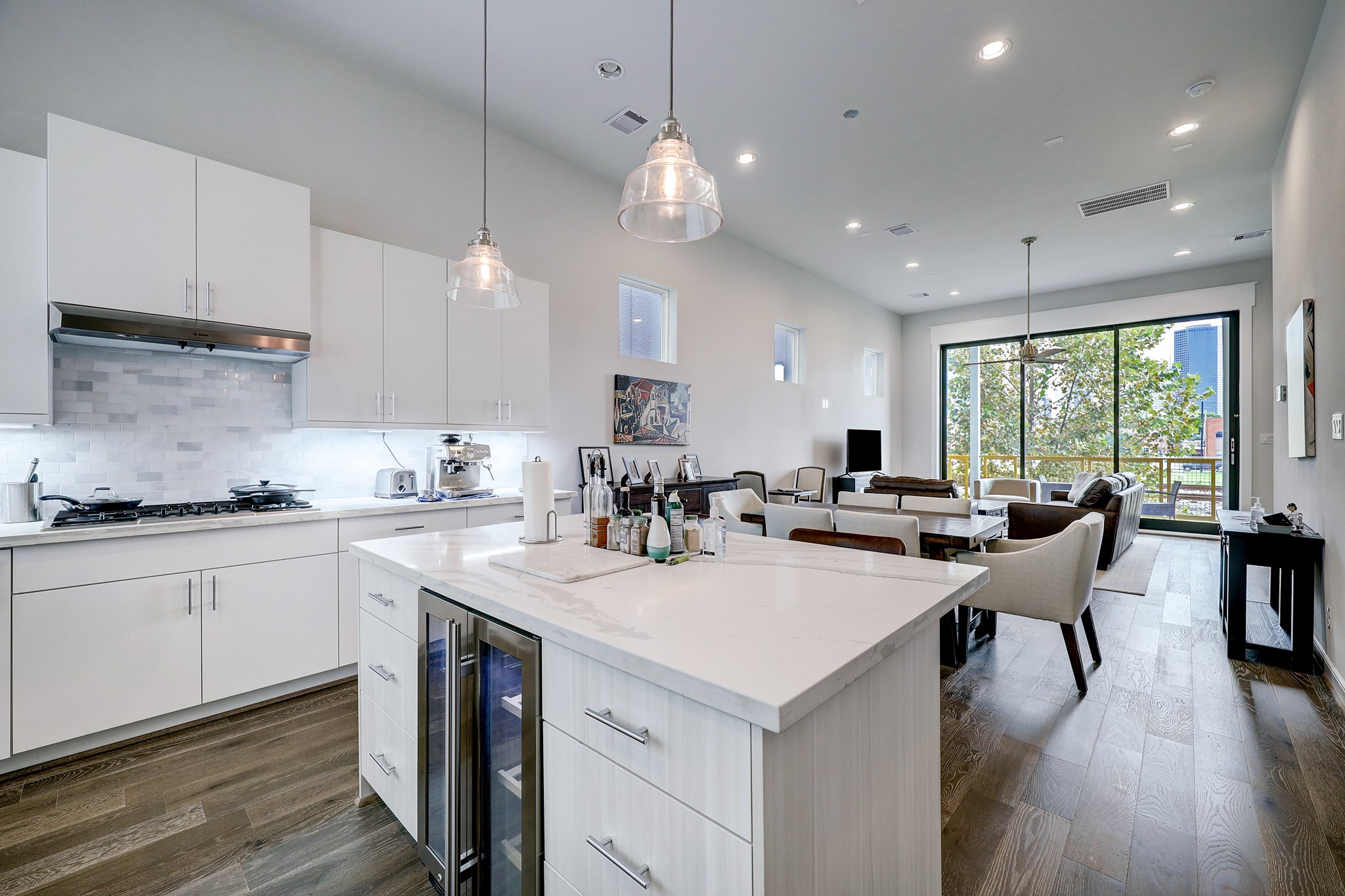 1203 Hickory Street, Unit D Houston, TX 77007 - Photo 6 of 23 a kitchen with counter space appliances and wooden floor