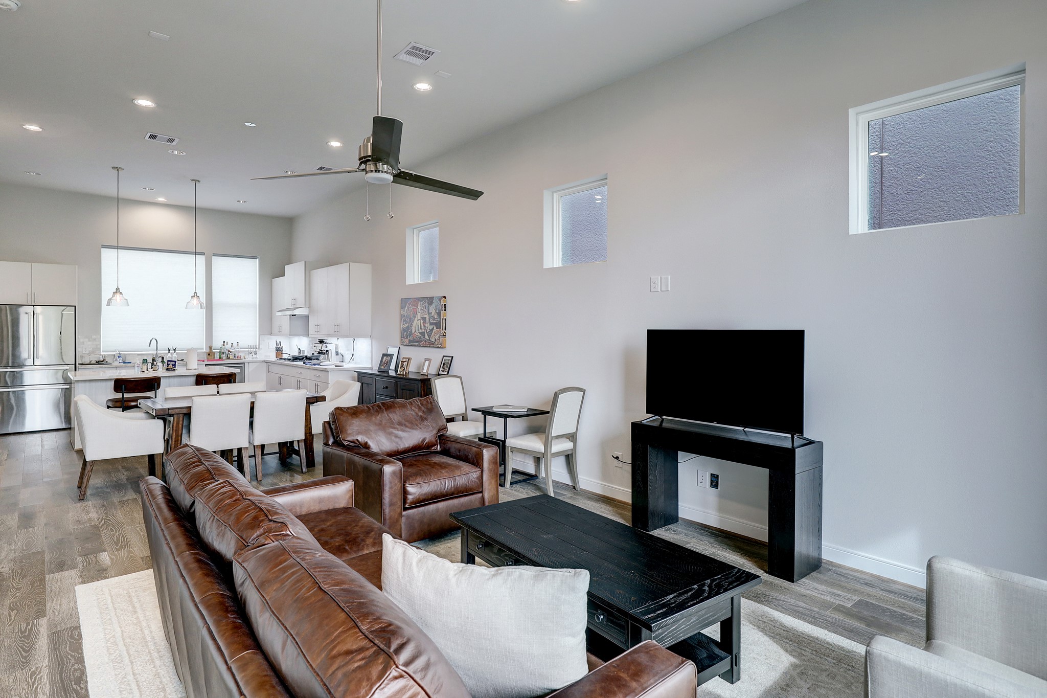 1203 Hickory Street, Unit D Houston, TX 77007 - Photo 10 of 23 a living room with furniture and a flat screen tv