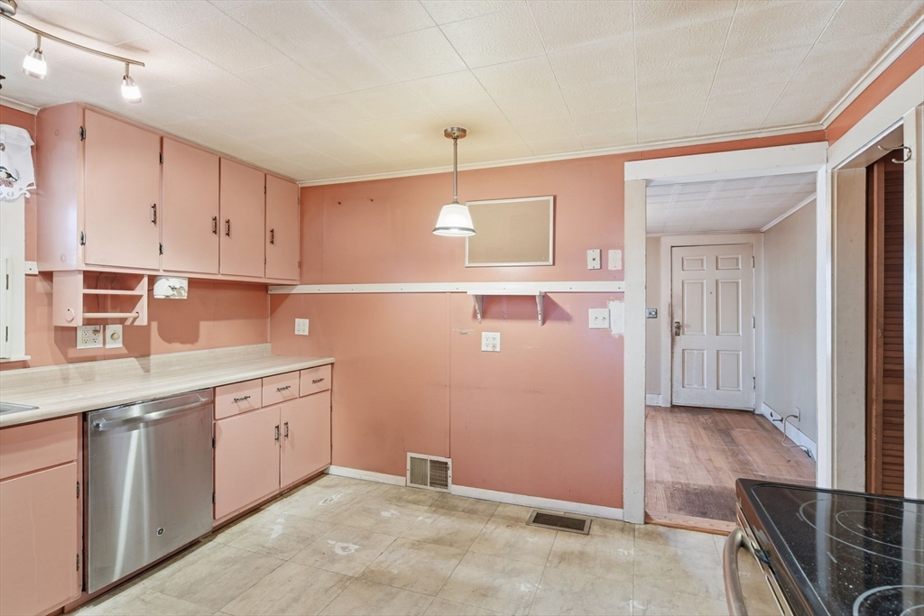 138 Warrenton Street Springfield, MA 01109 - Photo 12 of 33 a kitchen with cabinets and window