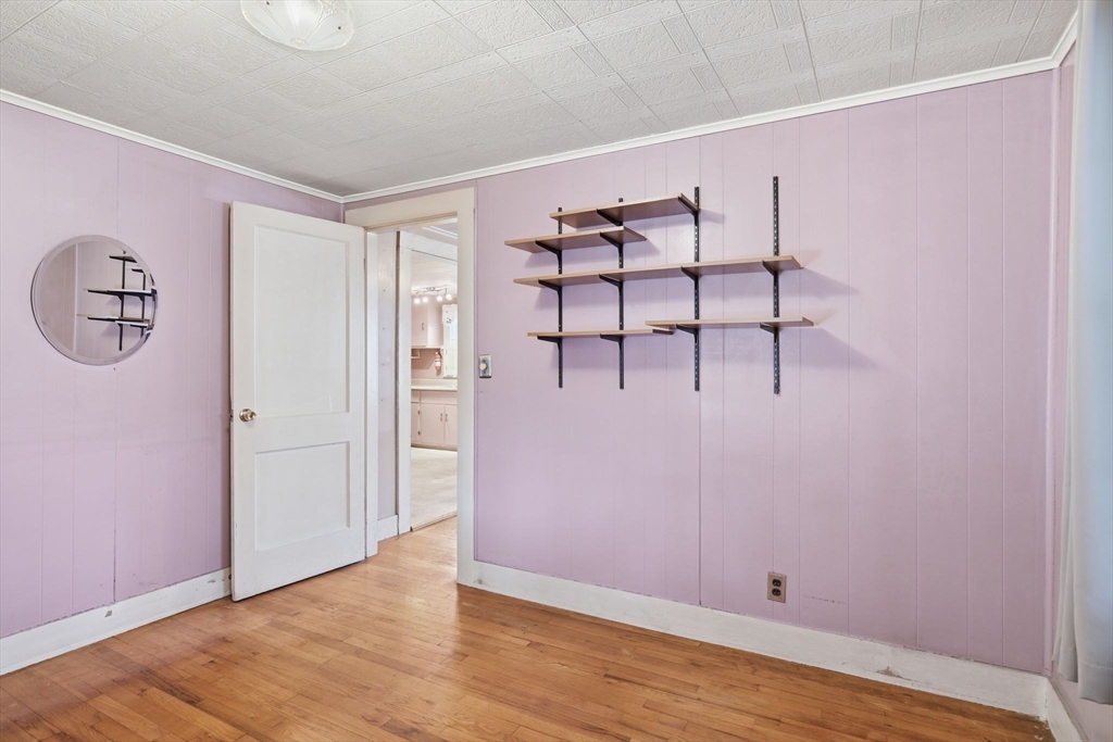 138 Warrenton Street Springfield, MA 01109 - Photo 14 of 33 an empty room with wooden floor and windows