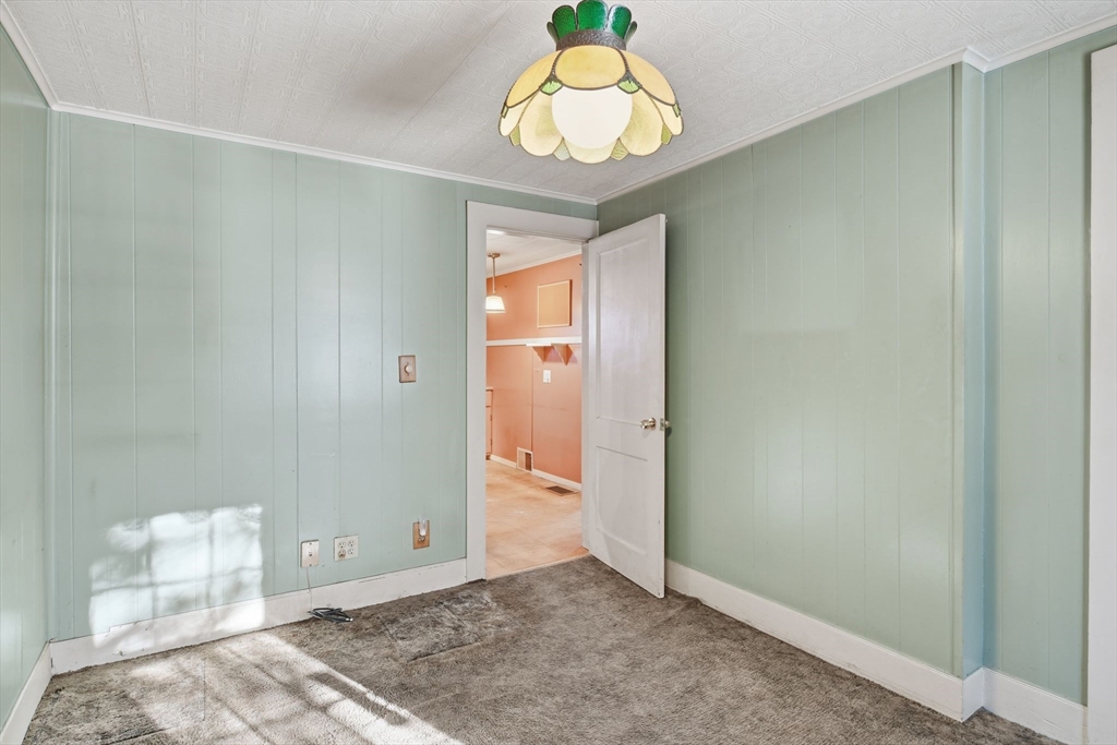 138 Warrenton Street Springfield, MA 01109 - Photo 18 of 33 a view of a room with wooden floor and bench