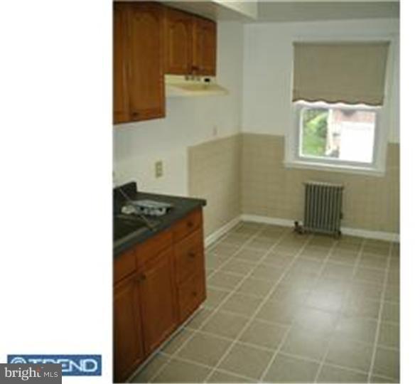 1629 Murdoch Road, Unit B2 Philadelphia, PA 19150 - Photo 3 of 9 a kitchen with a sink and cabinets