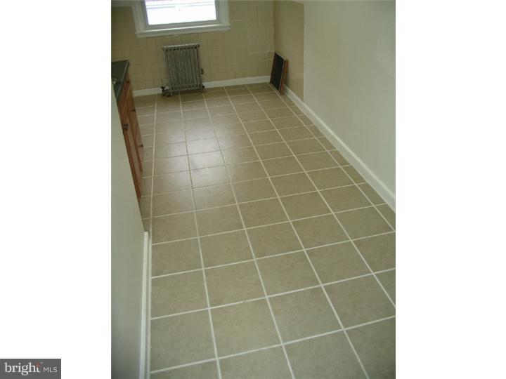 1629 Murdoch Road, Unit B2 Philadelphia, PA 19150 - Photo 4 of 9 a bathroom with a bathtub and window