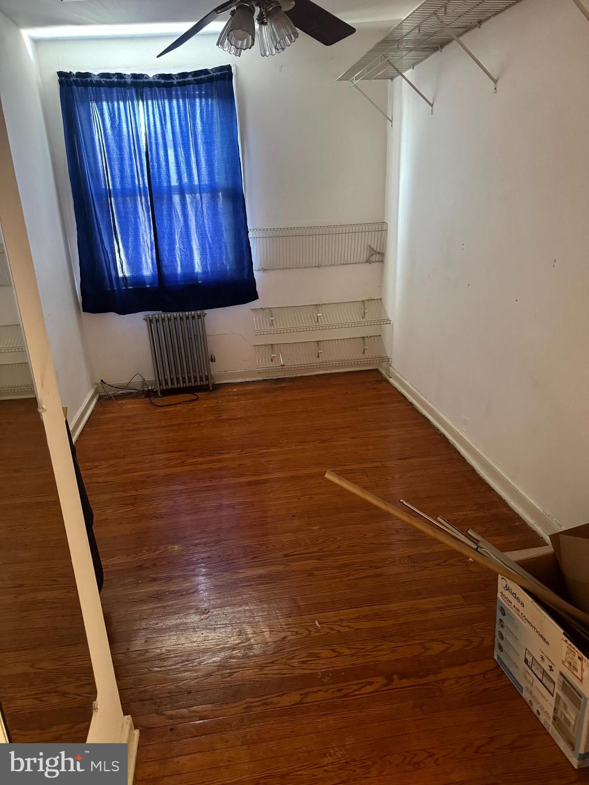 1629 Murdoch Road, Unit B2 Philadelphia, PA 19150 - Photo 5 of 7 a view of a closet with wooden floor