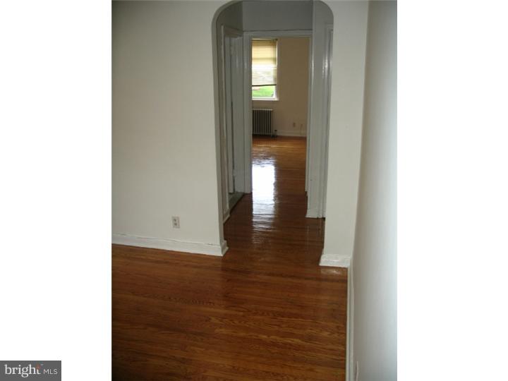 1629 Murdoch Road, Unit B2 Philadelphia, PA 19150 - Photo 6 of 9 a view of a hallway with wooden floor