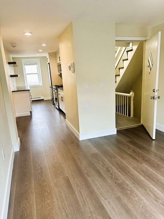 15 Clark Street, Unit 3 Boston, MA 02113 - Photo 3 of 8 a view of a hallway with wooden floor