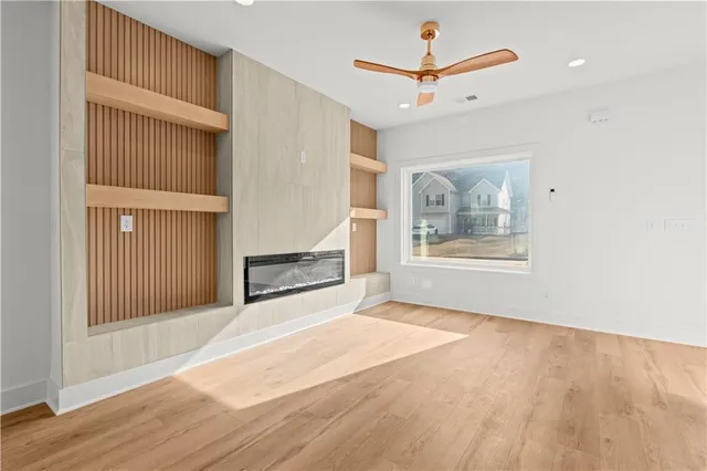 a view of an entryway with wooden floor