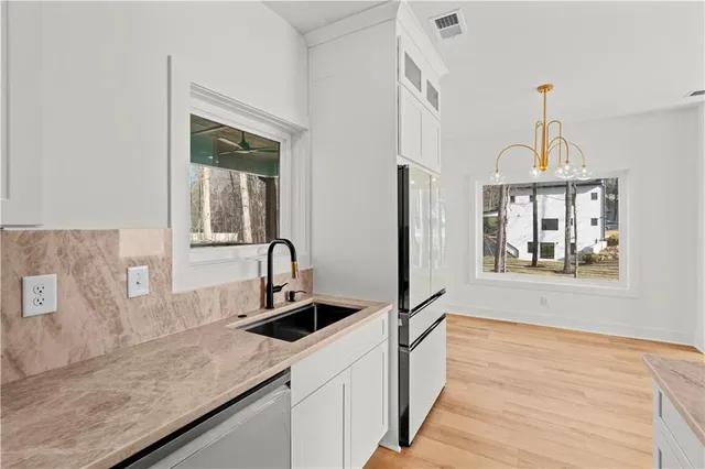 a view of a hallway with staircase