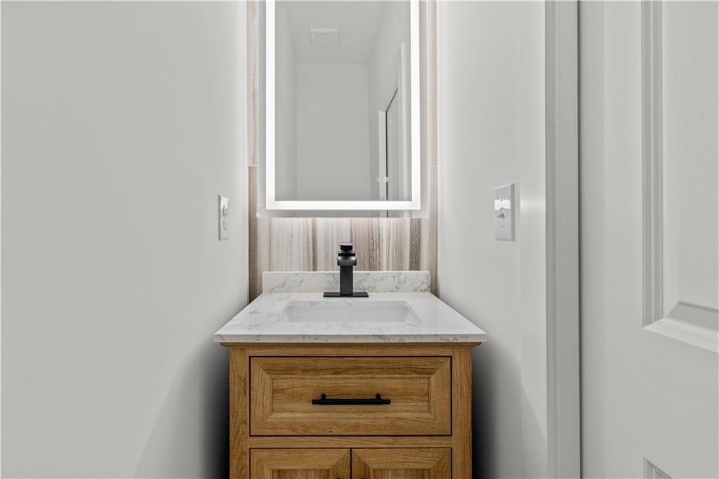 744 Crystal Bay Road Villa Rica, GA 30180 - Photo 21 of 69 a bathroom with a sink and a mirror