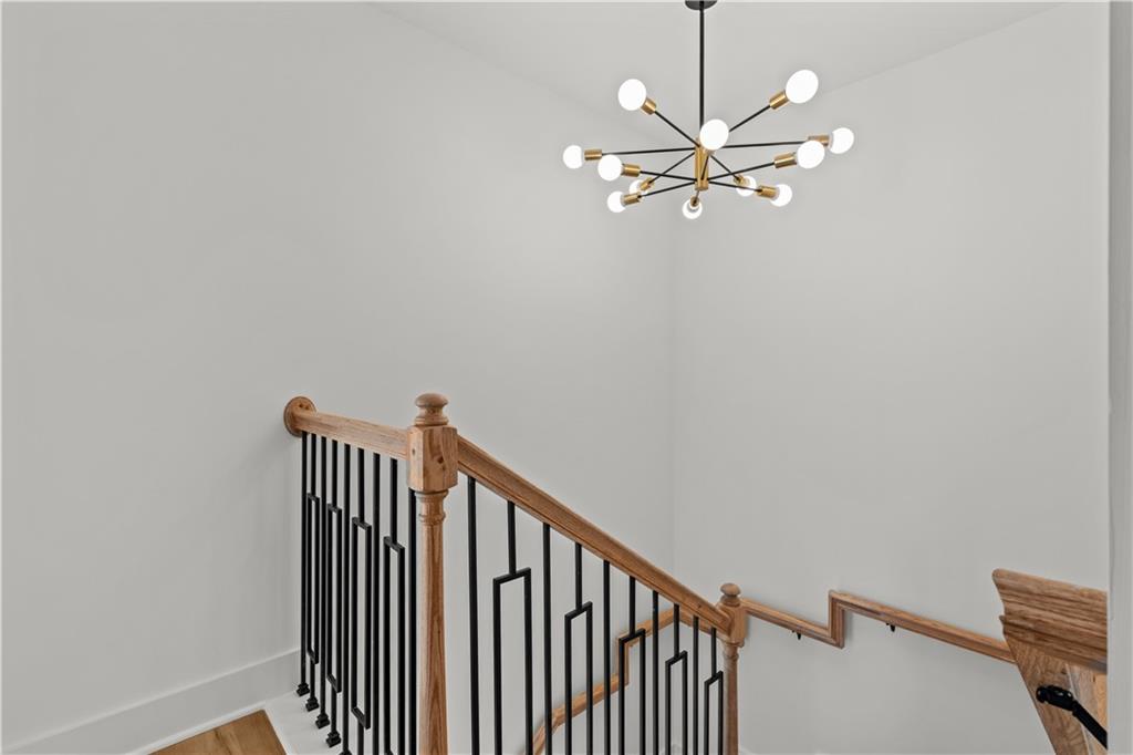 744 Crystal Bay Road Villa Rica, GA 30180 - Photo 26 of 69 a view of a hallway with a chandelier