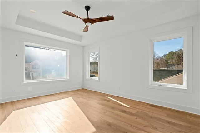 a bathroom with a granite countertop sink a toilet and a shower