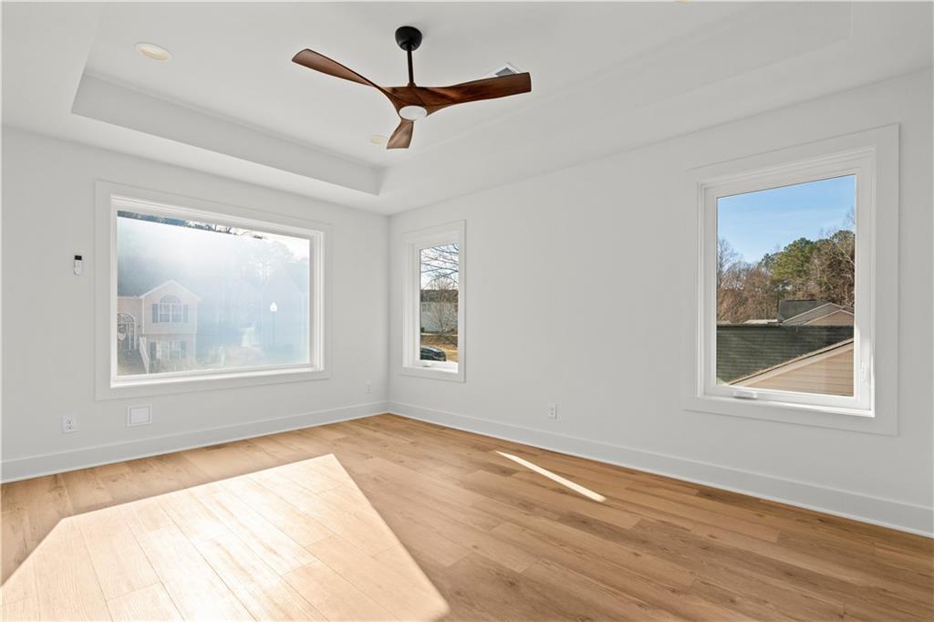 744 Crystal Bay Road Villa Rica, GA 30180 - Photo 27 of 69 a view of an empty room with wooden floor and a window