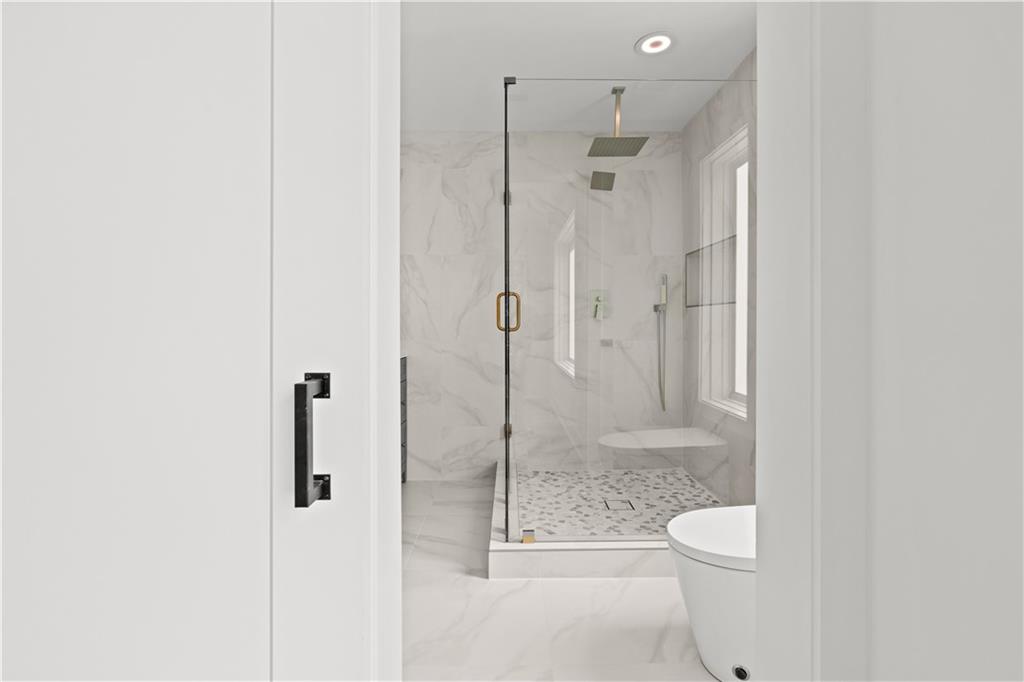 744 Crystal Bay Road Villa Rica, GA 30180 - Photo 30 of 69 a bathroom with a shower toilet and sink