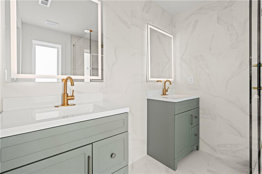 744 Crystal Bay Road Villa Rica, GA 30180 - Photo 31 of 69 a bathroom with a sink and a mirror