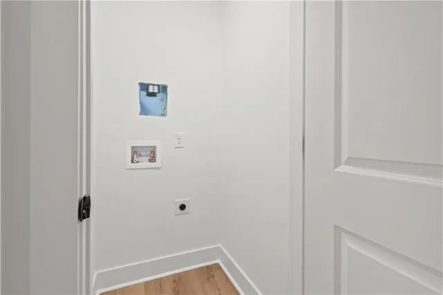 a kitchen with a stove and a microwave