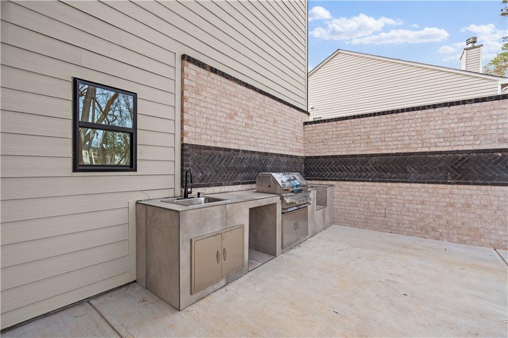 744 Crystal Bay Road Villa Rica, GA 30180 - Photo 49 of 69 a kitchen with a stove and a microwave