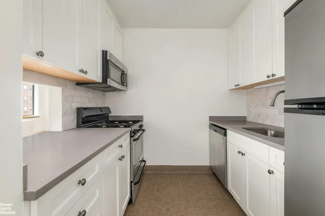 a view of a hallway with white walls