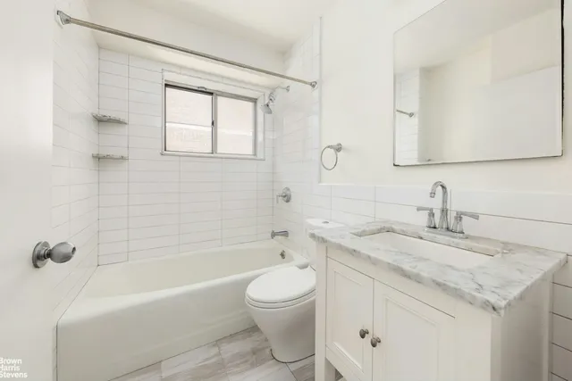a kitchen with stainless steel appliances a sink stove and cabinets