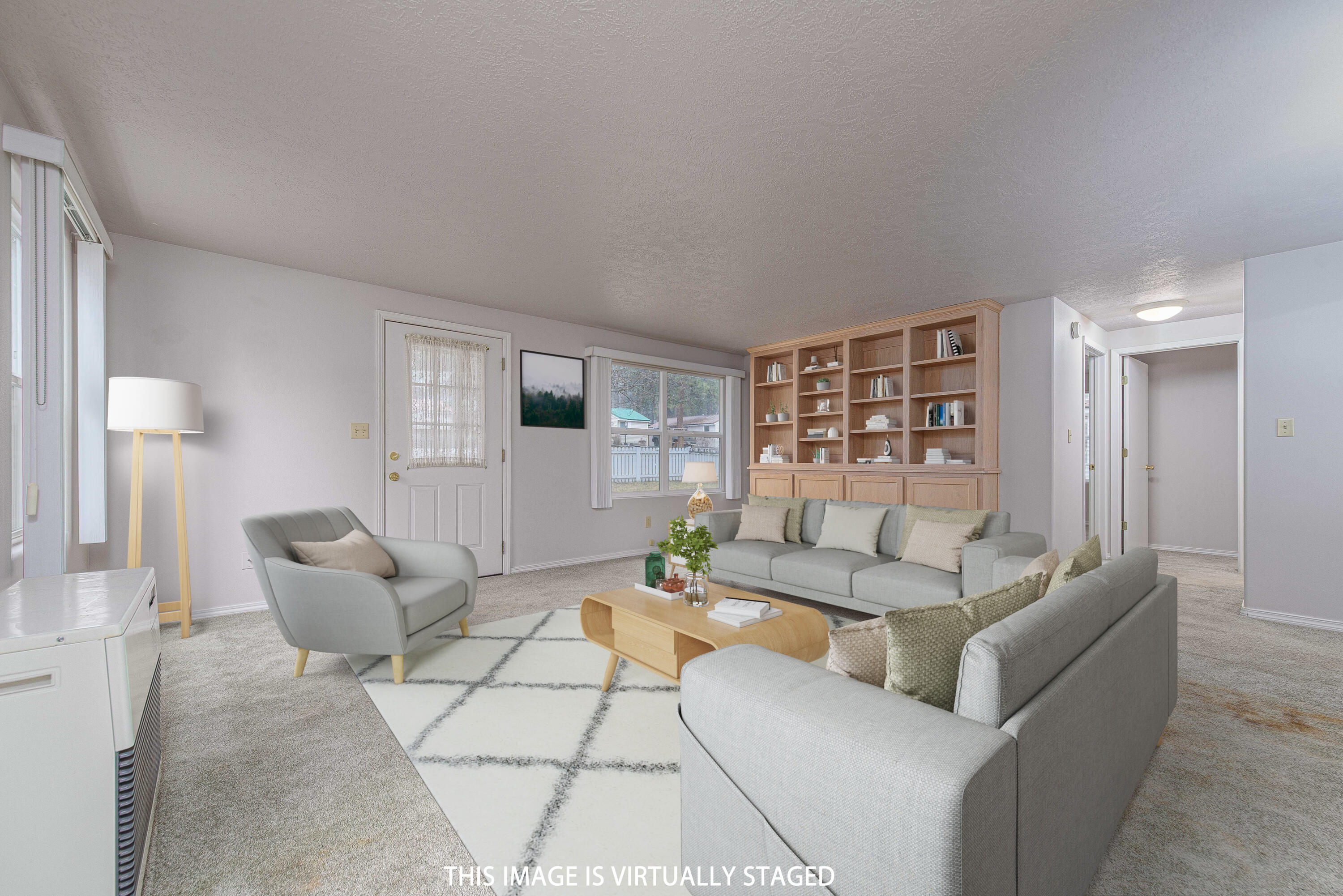 138722 Rhododendron Street Gilchrist, OR 97737 - Photo 12 of 36 a living room with furniture and a large window