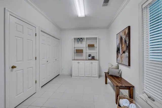 a view of room with window and furniture