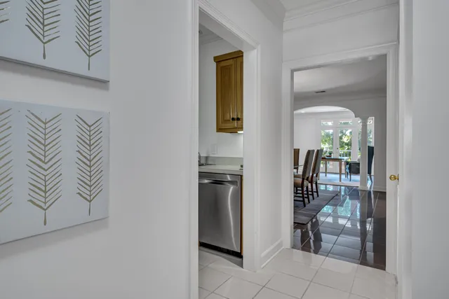 a kitchen with a refrigerator and table