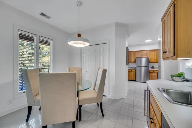 a kitchen with stainless steel appliances granite countertop a sink a stove and a refrigerator