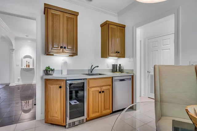 a spacious bathroom with a granite countertop sink and a mirror