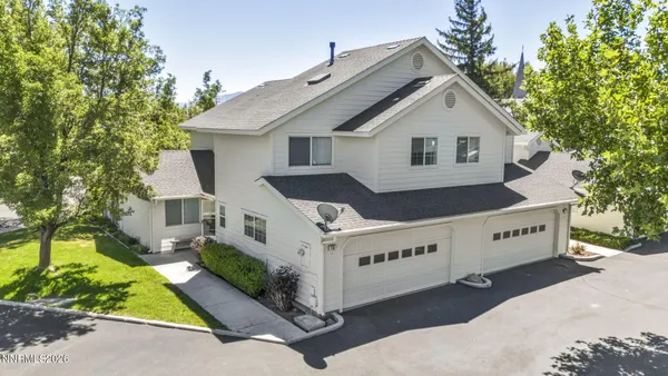 a view of a house with a yard and plants