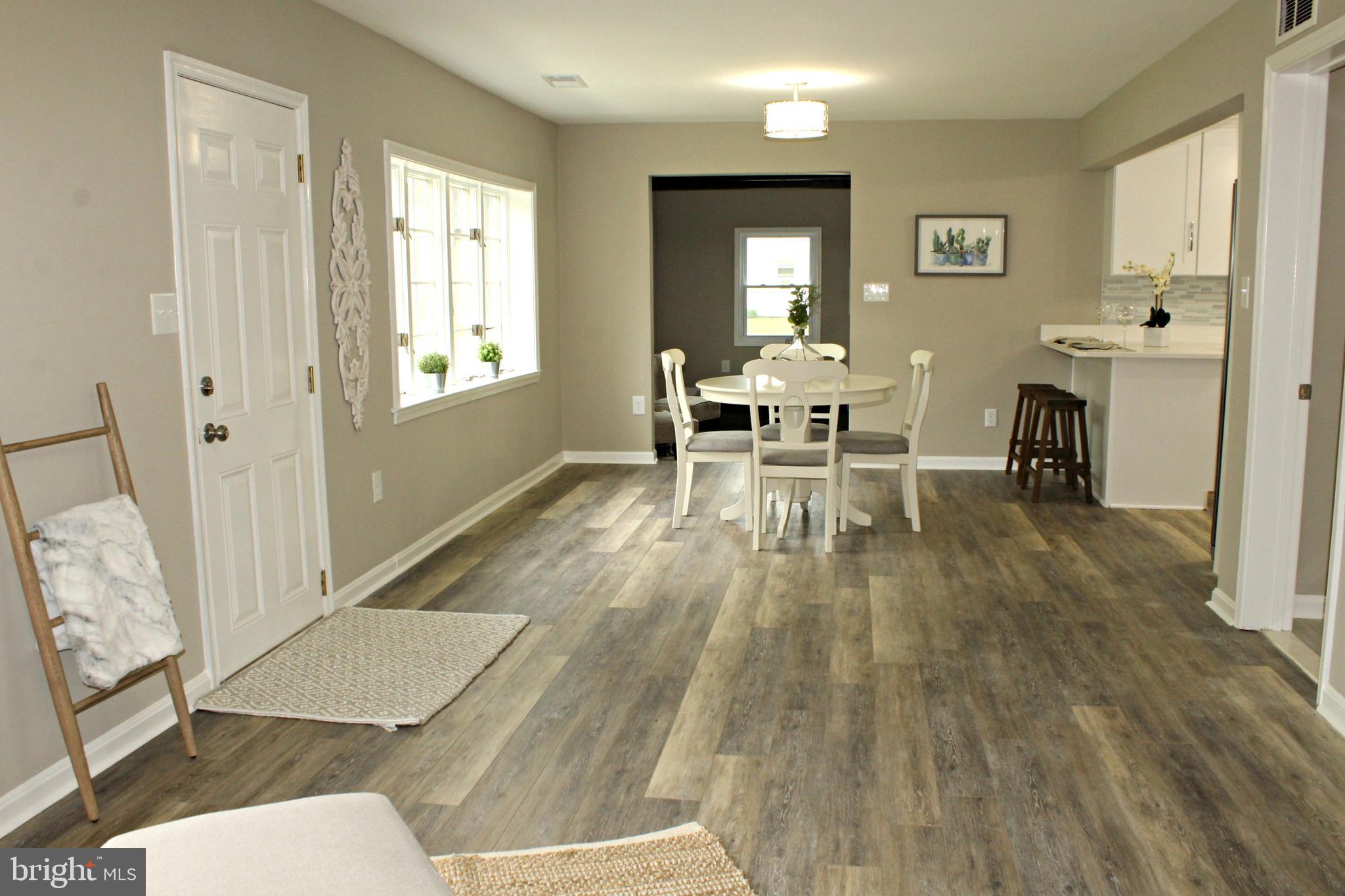 13105 Joy Road Lusby, MD 20657 - Photo 12 of 28 Huge, open living room/dining room combination!