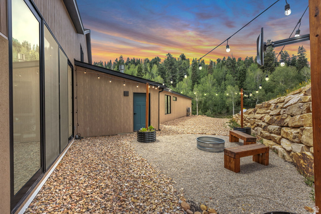 1766 West Tollgate Cyn Road Coalville, UT 84017 - Photo 44 of 59 Exterior patio featuring gravel surfacing and a large rock retaining wall