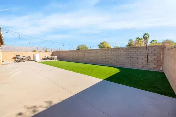 a view of a back yard of the house