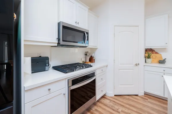 a kitchen with a stove and a microwave