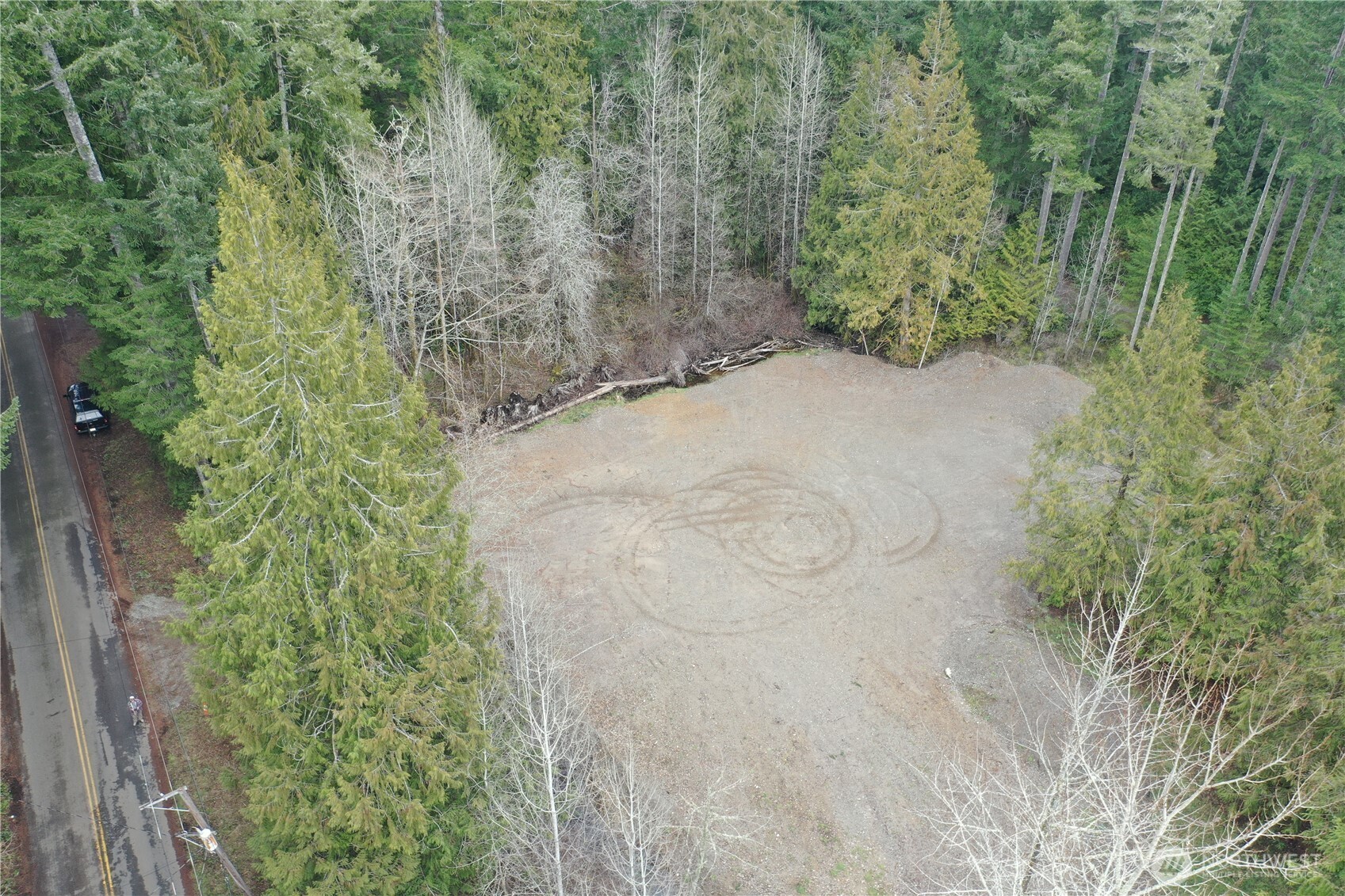721 East Phillips Lake Loop Road Shelton, WA 98584 - Photo 13 of 30 a view of a yard with plants and wooden fence