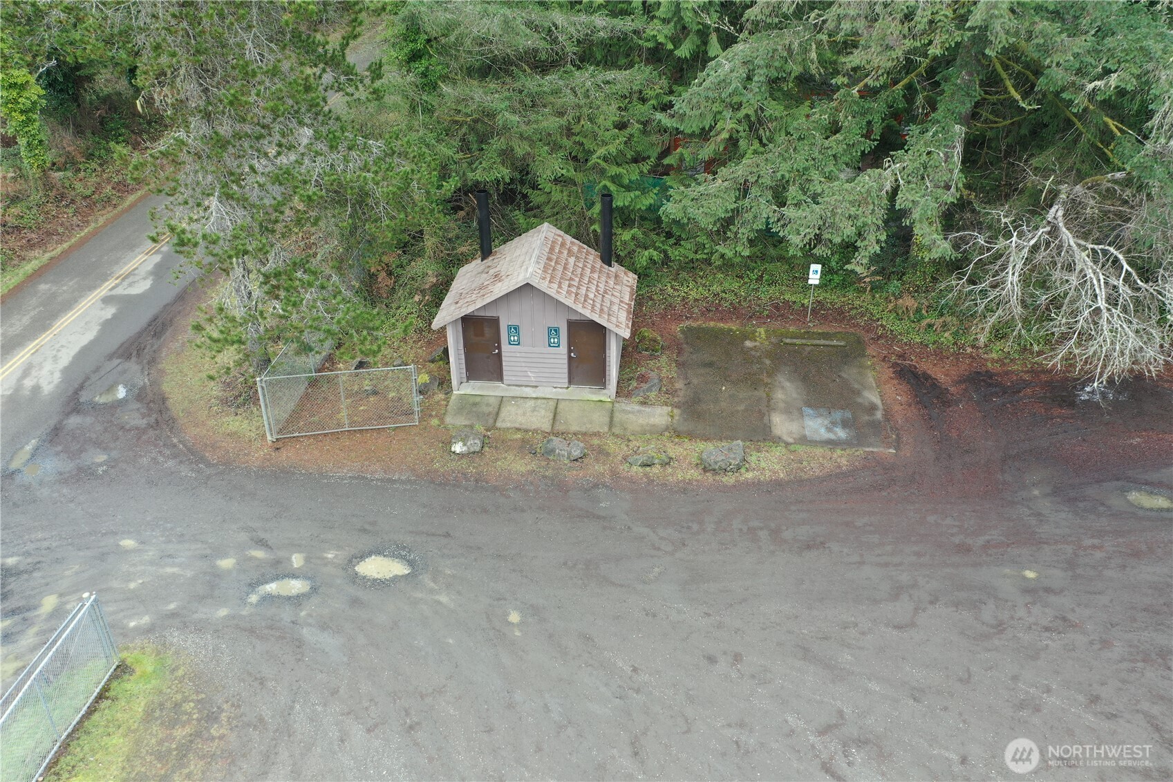 721 East Phillips Lake Loop Road Shelton, WA 98584 - Photo 16 of 30 a view of a small house with a yard and large tree