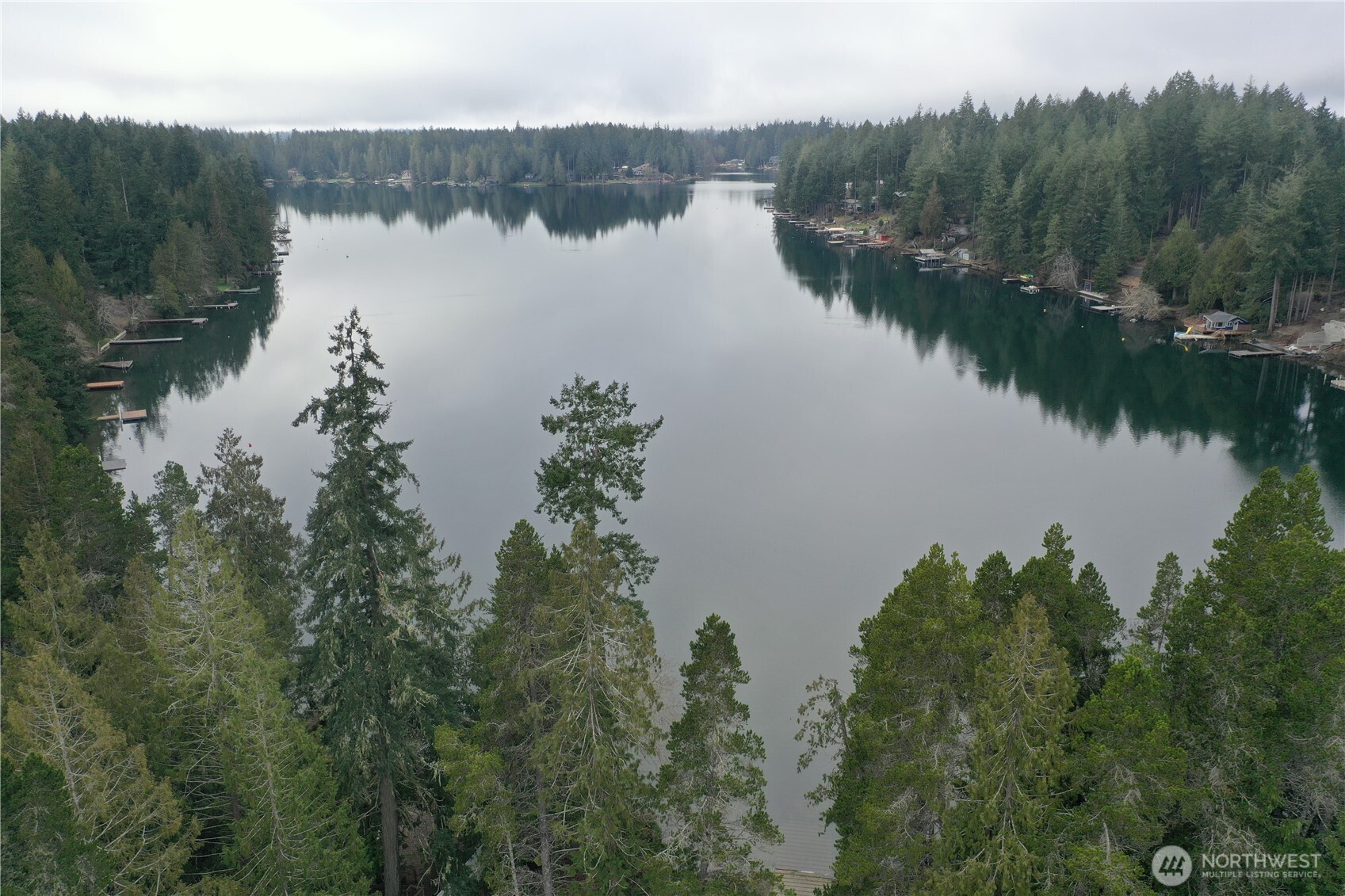 721 East Phillips Lake Loop Road Shelton, WA 98584 - Photo 17 of 30 a view of a lake in middle of forest