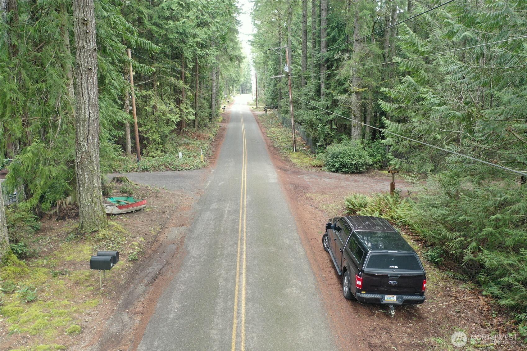 721 East Phillips Lake Loop Road Shelton, WA 98584 - Photo 4 of 30 a car parked in the side of the road