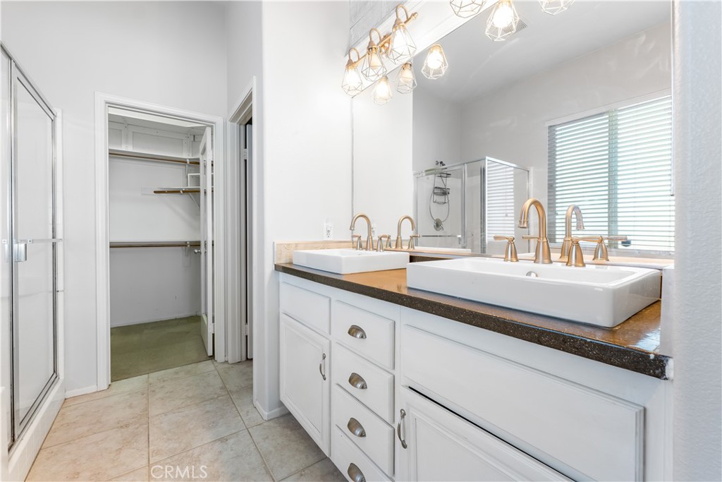 40445 Chantemar Way Temecula, CA 92591 - Photo 15 of 28 a bathroom with a sink double vanity and a mirror