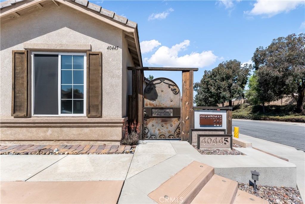 40445 Chantemar Way Temecula, CA 92591 - Photo 4 of 28 a front view of a house with garden