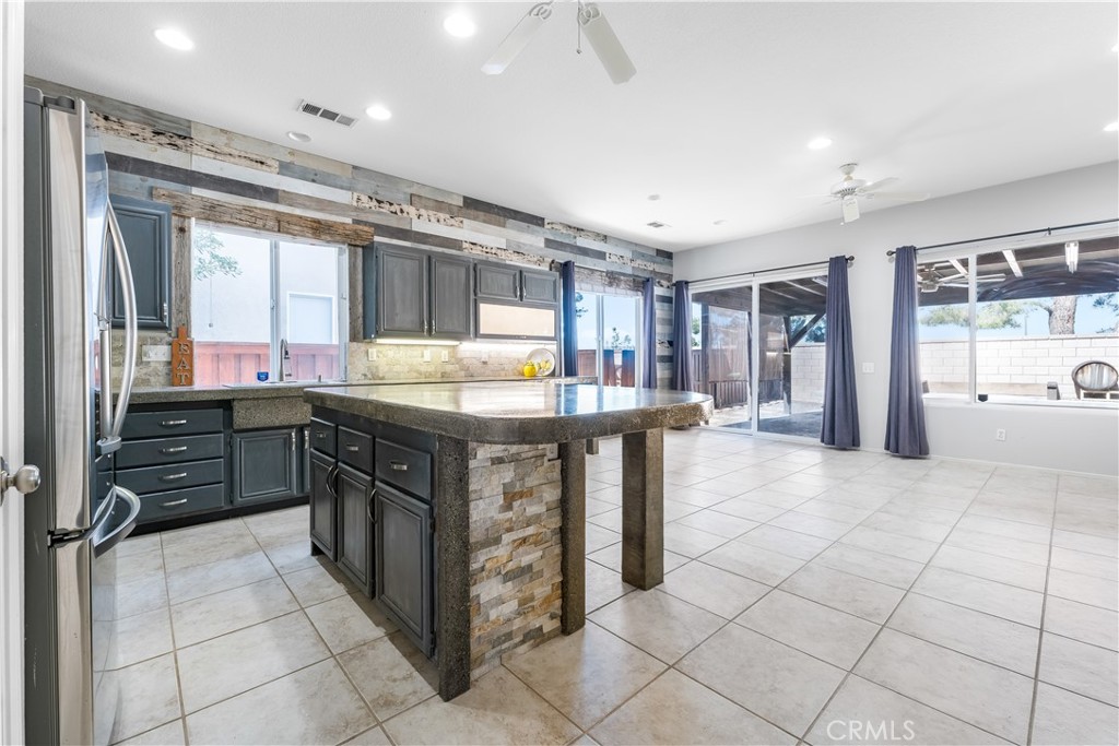 40445 Chantemar Way Temecula, CA 92591 - Photo 9 of 28 a kitchen with stainless steel appliances granite countertop a stove and a sink